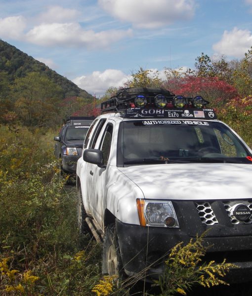 Load image into Gallery viewer, Nissan XTerra baja off road offroad roof rack gobiracks gobirack gobi stealth ranger light bar multi light setup wind deflector