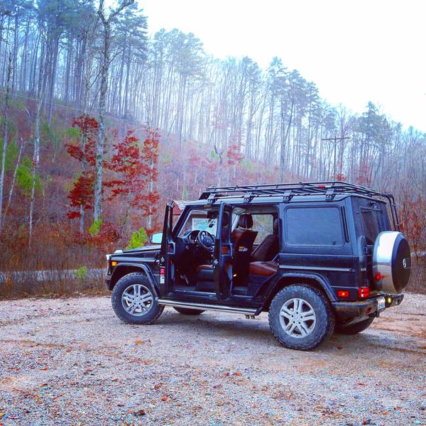 Load image into Gallery viewer, mercedes benz g wagon gobi racks stealth roof rack with ladder and light bar in forest
